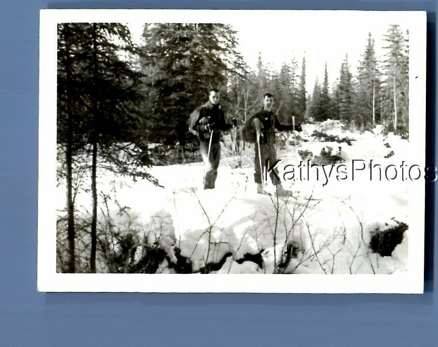 FOUND B&W PHOTO F+4780 MEN WALKING IN THE SNOW IN SNOW SHOES